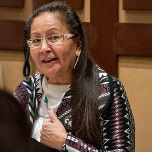 Headshot photo of Elder Genevieve Bruised Head speaking at conference