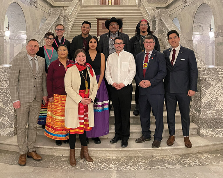 Keep Tobacco Sacred Tobacco Warriors and Changemakers standing on ornate stonework staircase at Legislative Building